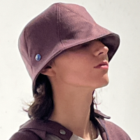 Lola is wearing a Le Panache Paris© bucket hat N°119 made in France with Parcel Loop fabric from Gabriel © 100% recyclable polyester