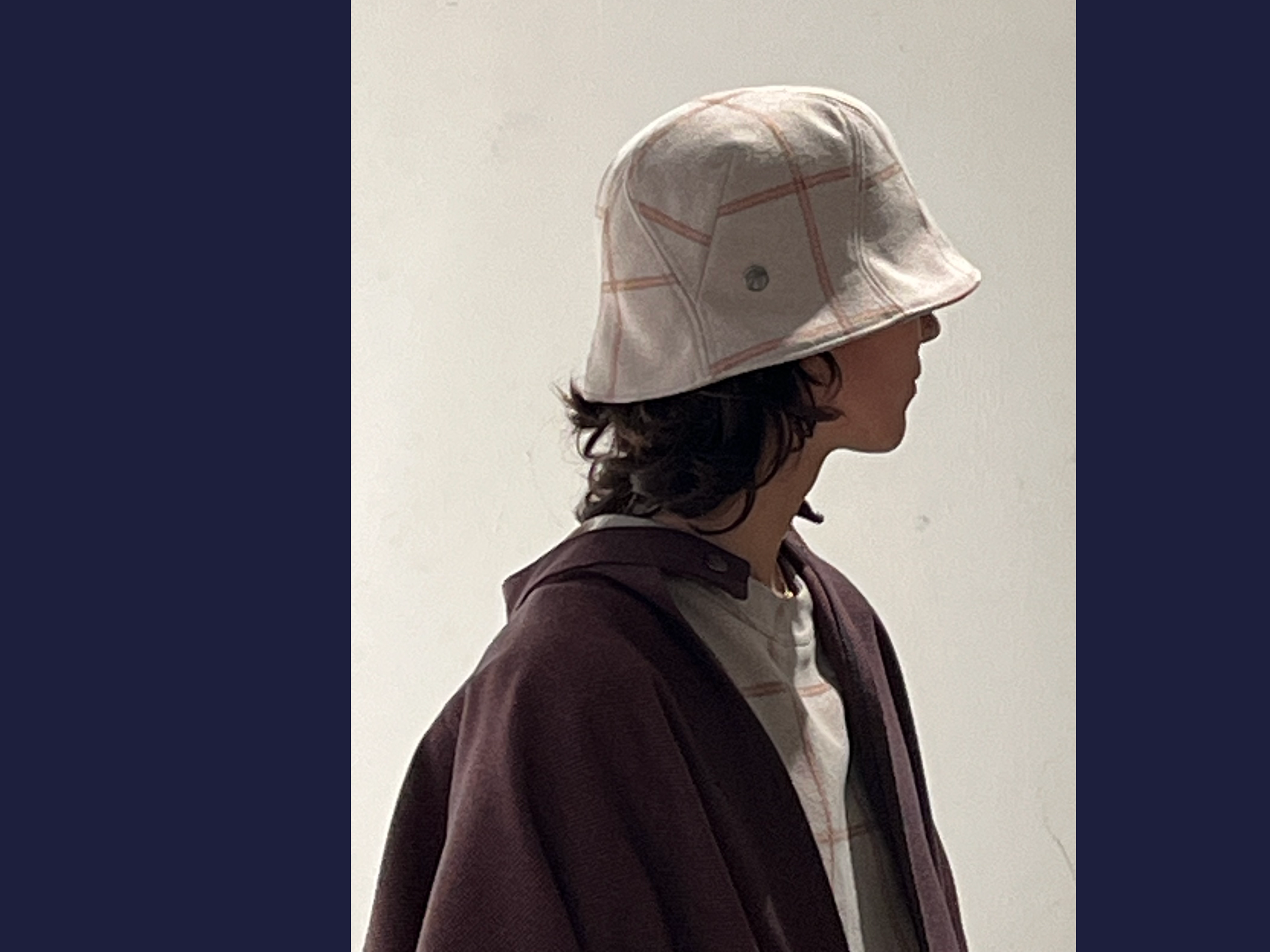Lola is wearing a Le Panache Paris© bucket hat N°117 made in France with Uptown fabric from Gabriel © 100% recyclable polyester
